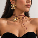 Set Flor Dorada con Perla y Aros