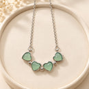 Collar magnético de corazones verdes trébol de cuatro hojas
