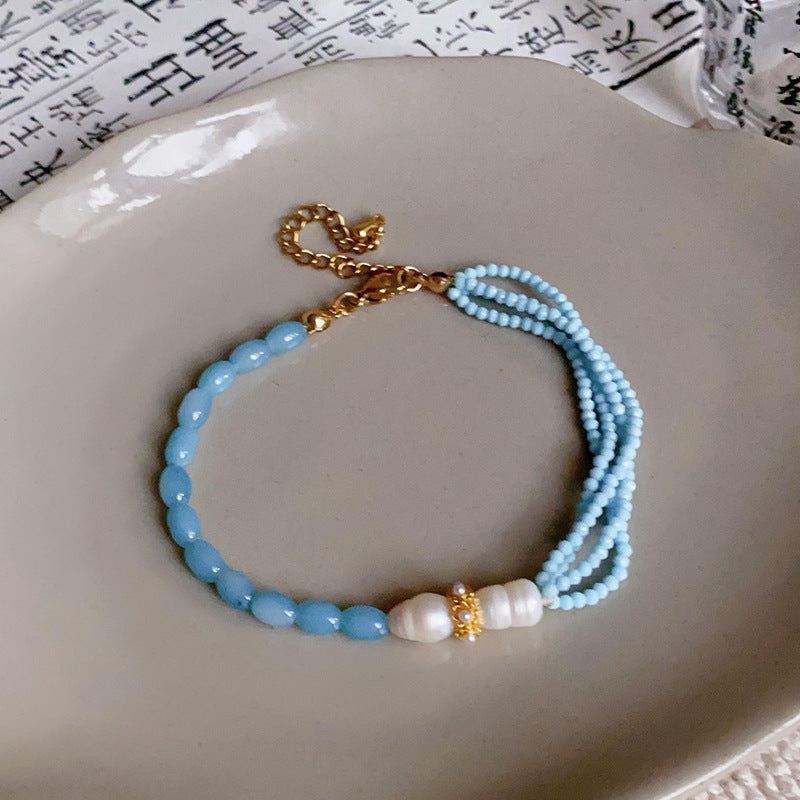 Pulsera Dorada Cristal Celeste y Perla
