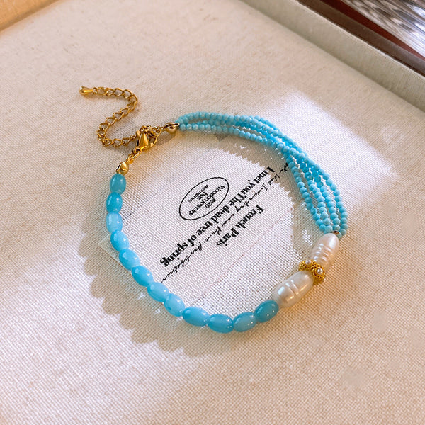 Pulsera Dorada Cristal Celeste y Perla